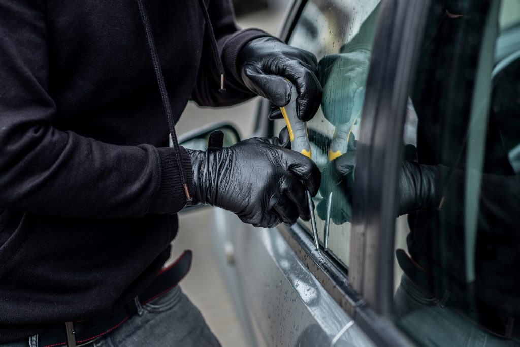 Stock photo of car theft from Adobe.