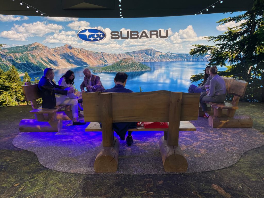 Virtual reality campfire scene. Only the Subaru logo gives it away.